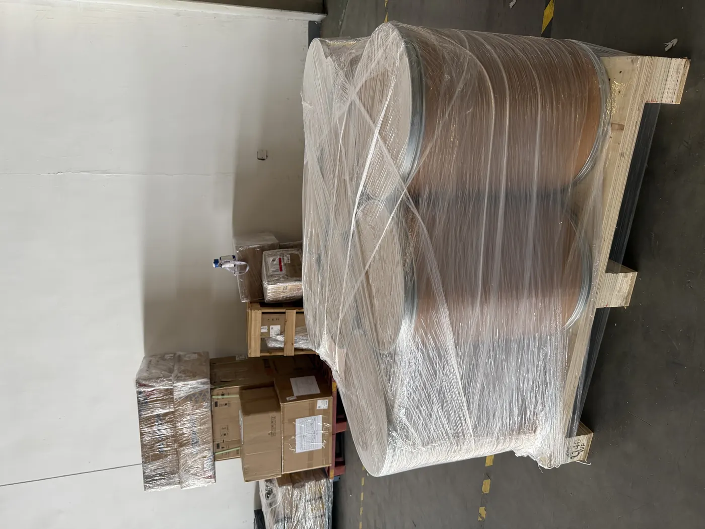 Bulk nutraceutical ingredient drums secured on a pallet for export shipment